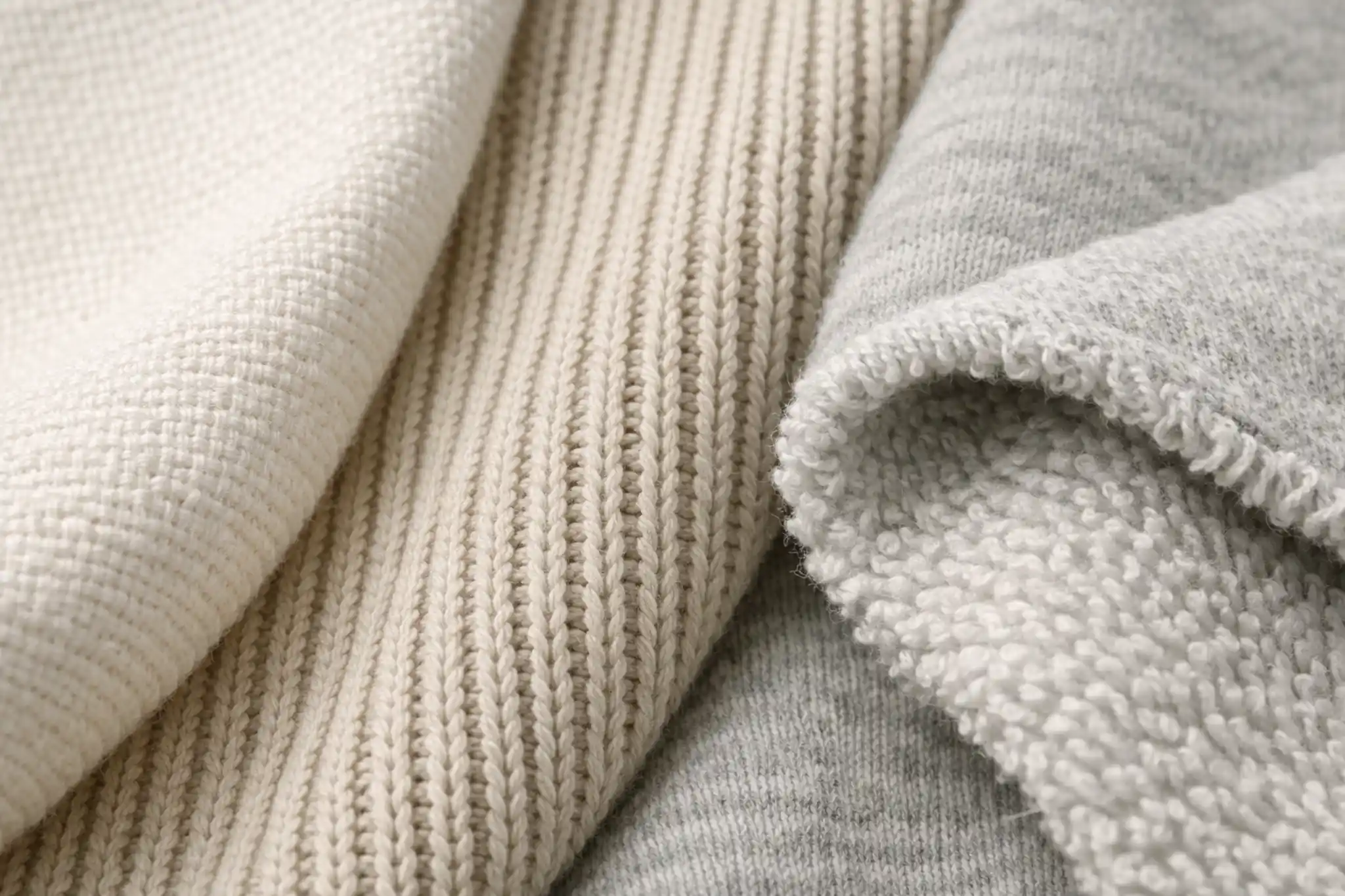 Different fabric textures including cotton, rib knit, and french terry materials